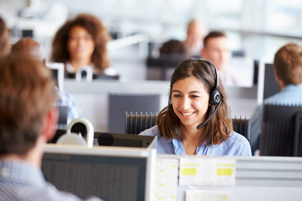 young_woman_working_in_call_centre_surrounded_by_colleagues