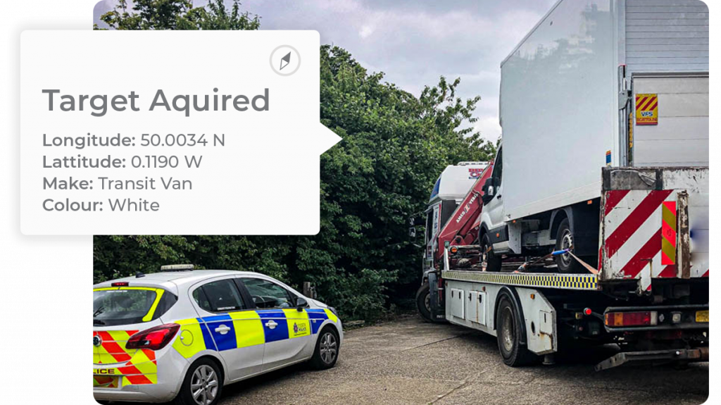 asset_tracking_vehicle_recovery_police_car_parked_up_as_van_is_collected_on_a_transporter