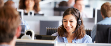 young_woman_working_in_call_centre_surrounded_by_colleagues