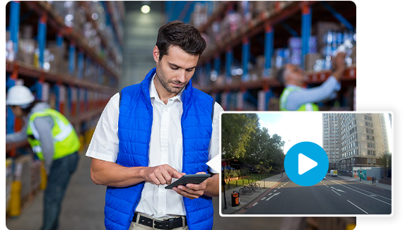 man_in_warehouse_using_mobile_device_to_review_and_download_4g_hd_dash_cam_footage