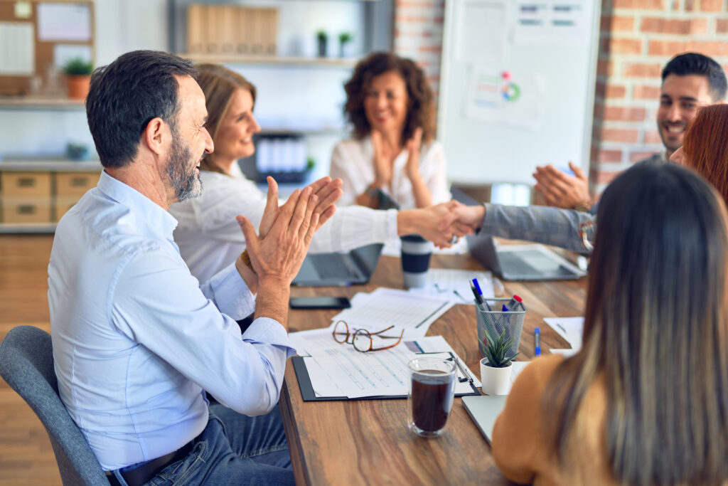 group_of_business_workers_smiling_happy_and_confident_working_together