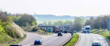 vehicles_driving_down_a_duel_carriageway_on_a_sunny_day